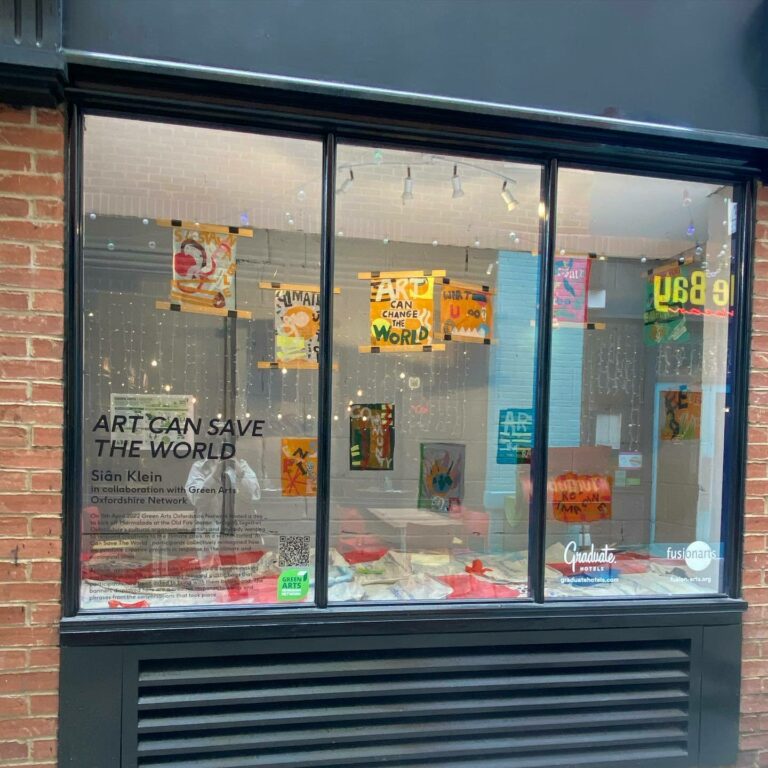 Image of the full 'Art Can Save the World' window display